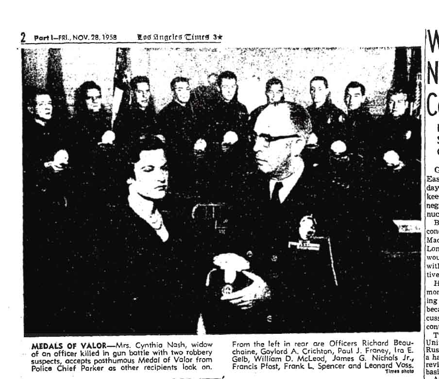 November 28, 1958: Police Chief William Parker presents Cynthia Nash with a posthumous Medal of Valor in honor of her late husband, Gene, who was killed in a shootout with robbery suspects. 