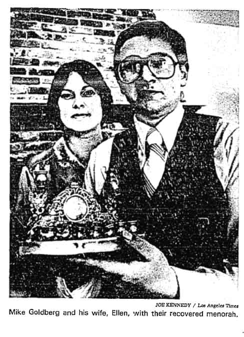 Mike Goldberg and his wife, Ellen, with their recovered menorah. Mike Goldberg and his wife, Ellen, with their recovered menorah.