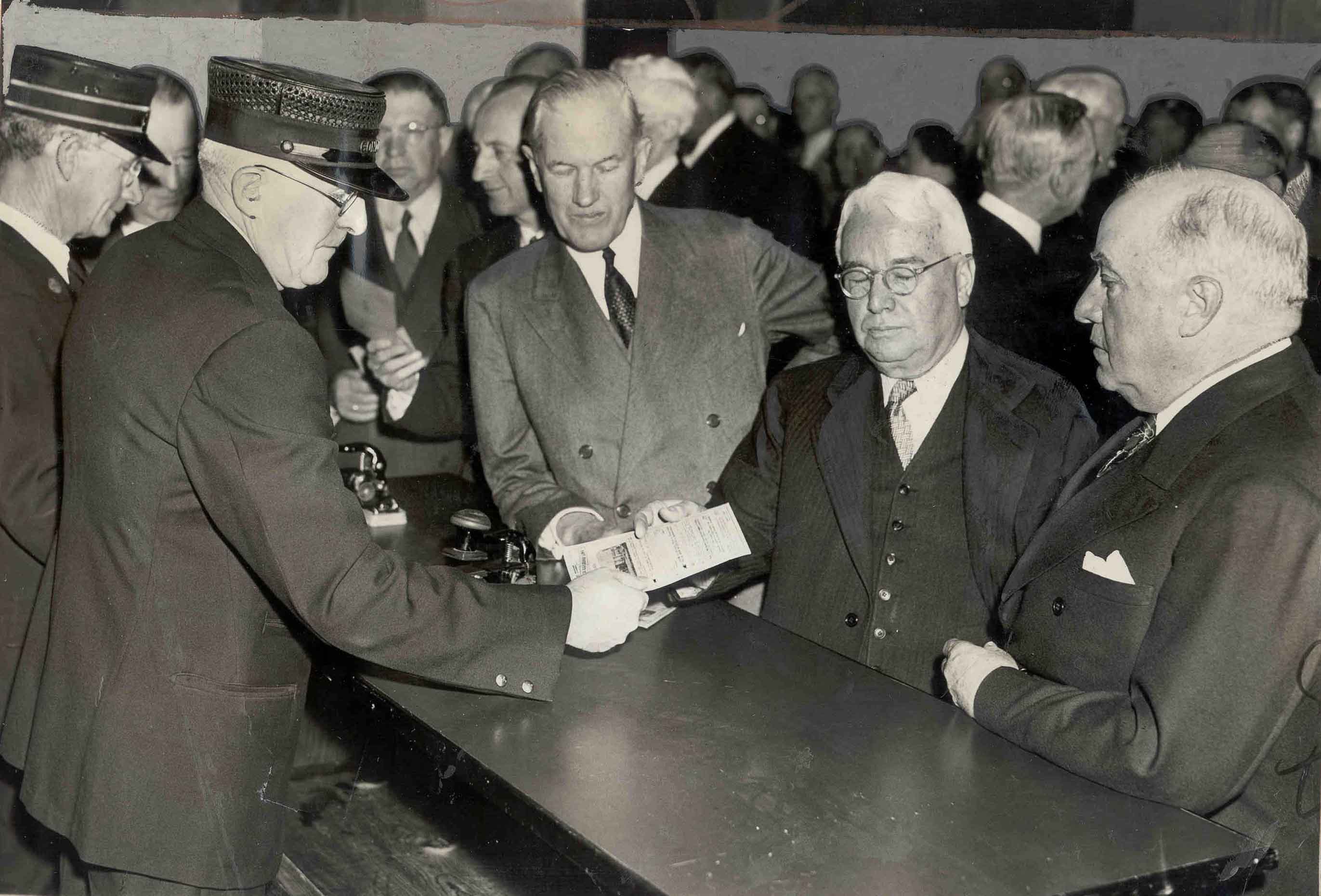 March 15, 1939: Luncheon at the Biltmore to plan the opening for union station. Guests get their tickets punched by railroad conductors. 
