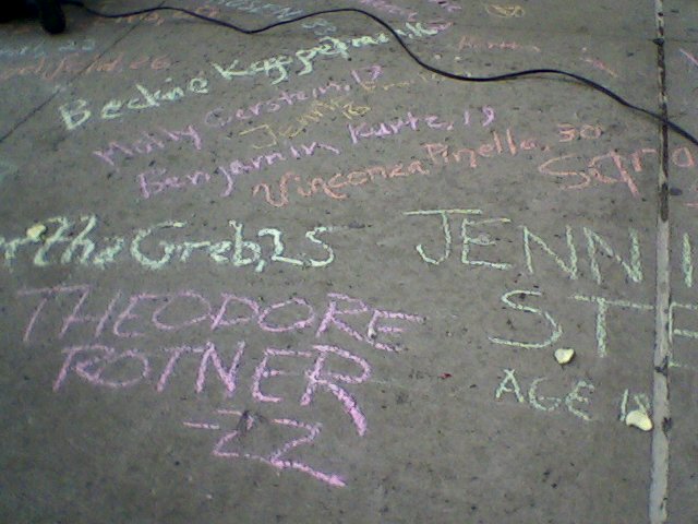 March 25, 2011: Fire victims' names chalked on the sidewalk