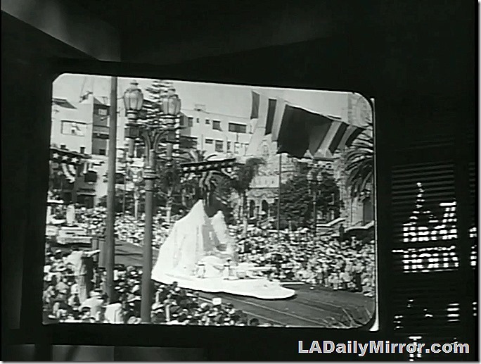 Rose Parade, The Brasher Doubloon. Newsreel footage of a float next to window showing the Broadway Hollywood sign