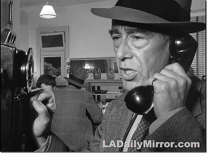 Dec. 14, 2021, Mystery Photo, close shot of a man in a hat talking on the phone in a diner 