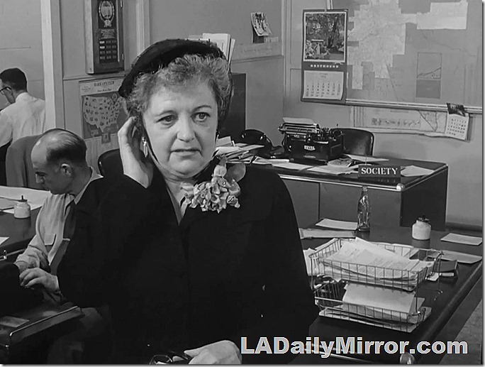 Dec. 15, 2021, Mystery Photo, a small newspaper office in the early 1950s. The fashion editor is smartly dressed for her era.  