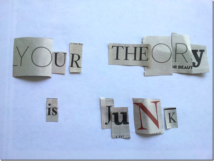 Your Theory Is Junk in cutout letters