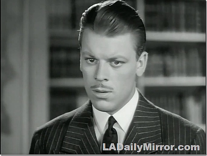 Young mystery man in pinstripes with mysterious mustache
