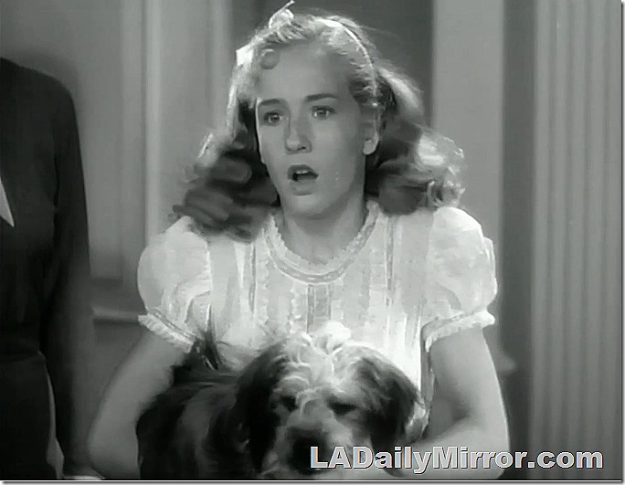 Young woman holds dog