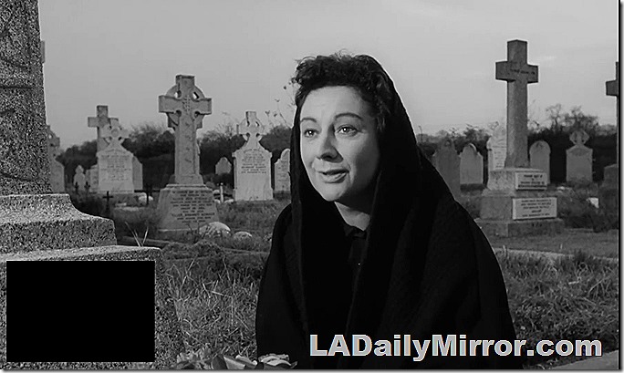 A mystery woman in a mysterious graveyard. In black and white.