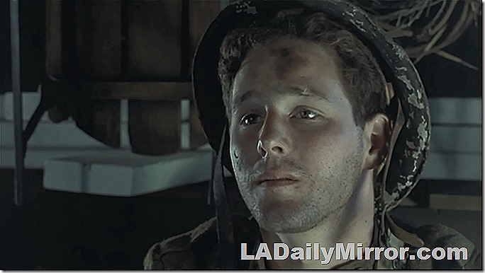Young man in World War I helmet