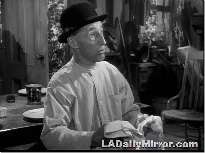 Mystery man in night shirt and bowler hat