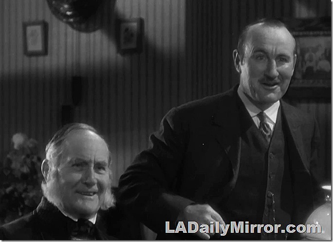 Aug. 10, 2022, Mystery Photo. Two jovial mystery guests. The seated man has majestic muttonchops and the other fellow is in a suit a vest. Aug. 10, 2022, Mystery Photo. Two jovial mystery guests. The seated man has majestic muttonchops and the other fellow is in a suit a vest.