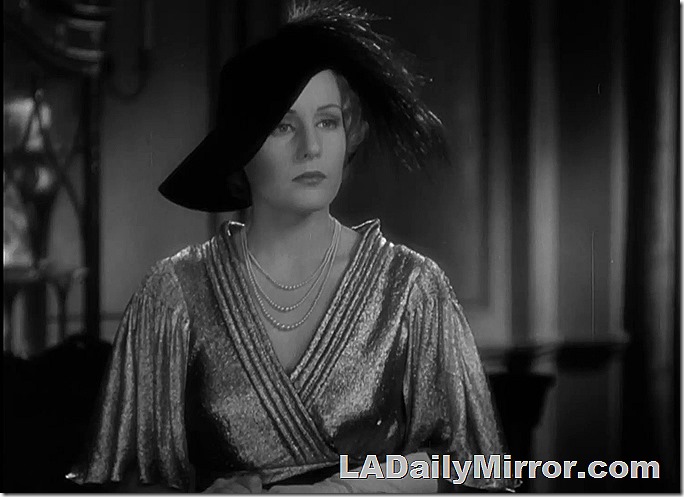 Elegant mystery woman in shimmering outfit and fancy hat Elegant mystery woman in shimmering outfit and fancy hat