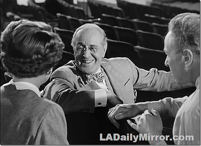 Mystery man in glasses and bow tie. How about them cufflinks? 