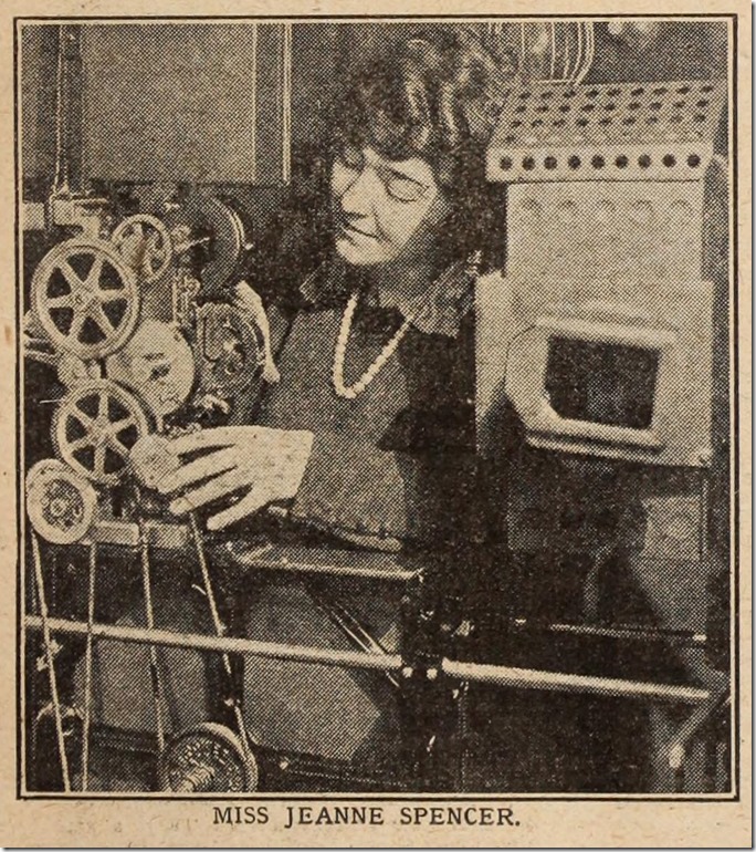 Jeanne Spender examining the mechanism of some film equipment