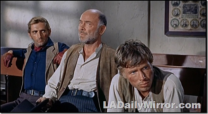 Three suspicious gents in vests. 