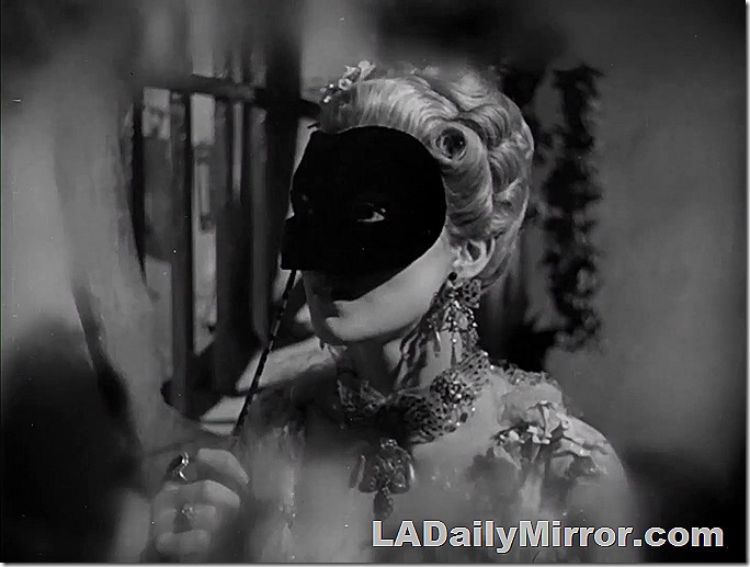 Elegantly dressed woman with a mask