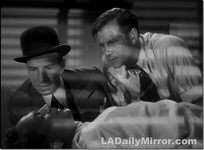 Mystery guests look at a mystery guest lying on his back. 