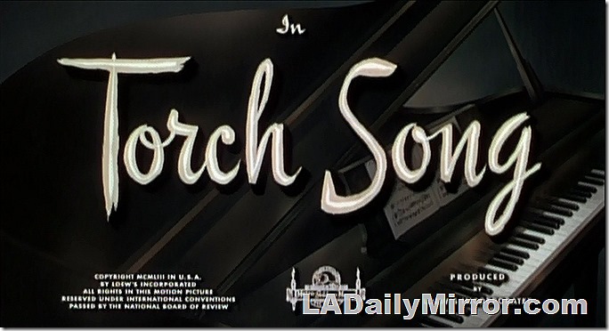 Main Title superimposed on an image of a grand piano