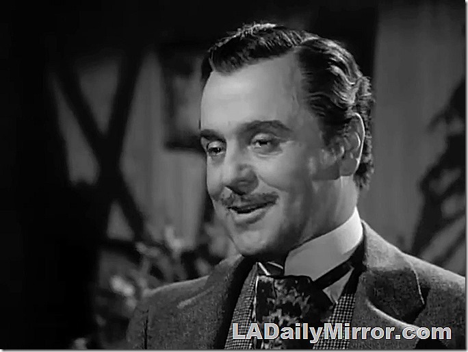 Debonair man with slight mustache, suit, vest and high-collared shirt. Debonair man with slight mustache, suit, vest and high-collared shirt.