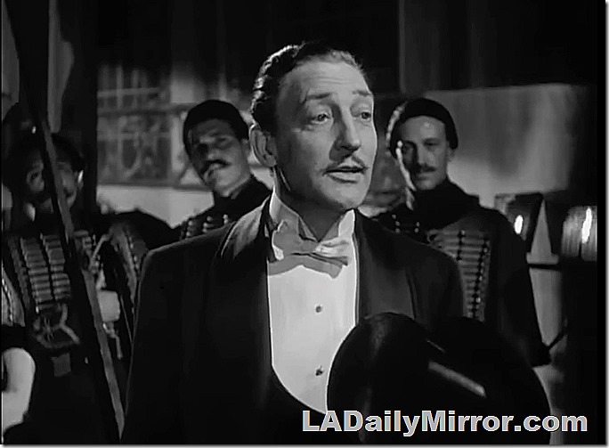 Mystery fellow in a tuxedo. Several musicians are in the background. Mystery fellow in a tuxedo. Several musicians are in the background.