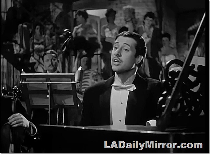 Man in tuxedo and bow tie sitting at a grand piano. Man in tuxedo and bow tie sitting at a grand piano.