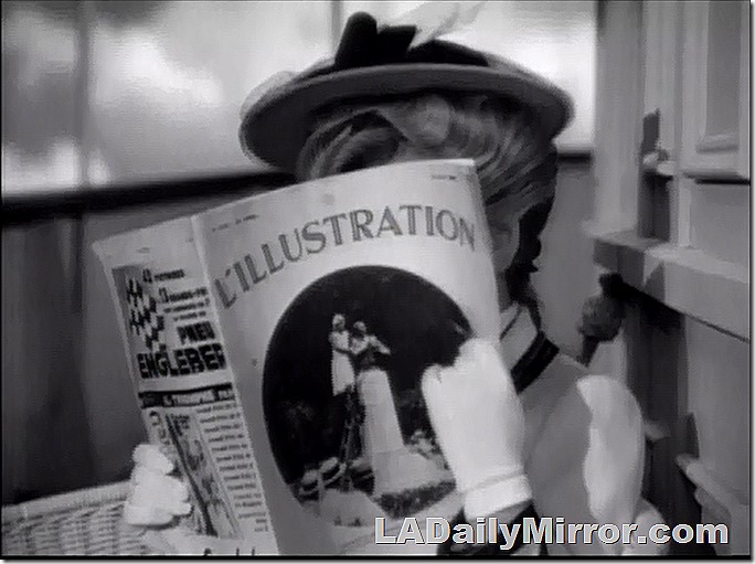 A lady reading a magazine that hides her face. 