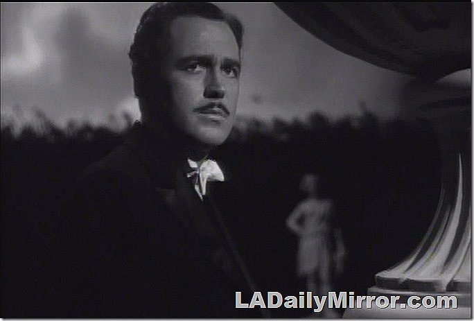 Moody image of moody man brooding and morose. With a moody, morose mustache