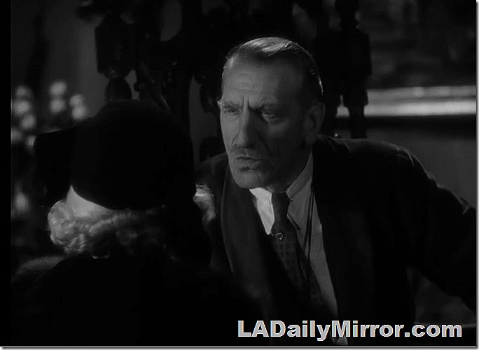 Distinguished looking man with mustache. Dramatic lighting. 