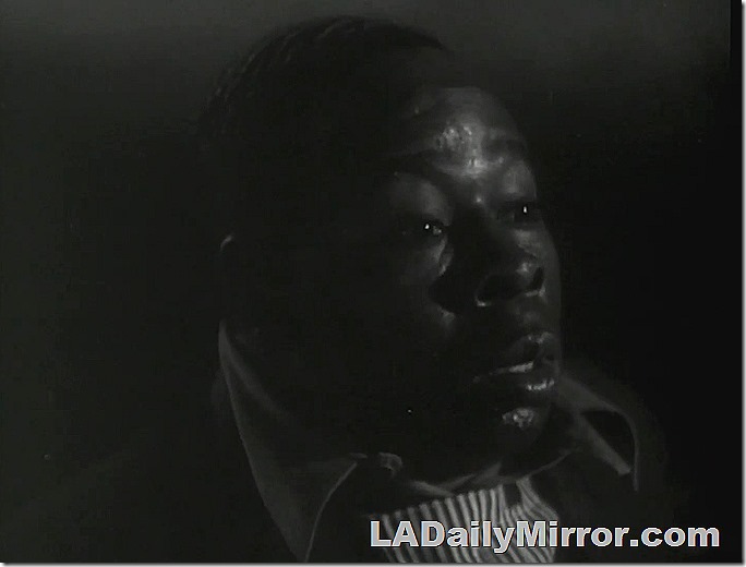 Nighttime. A man looks astonished. 