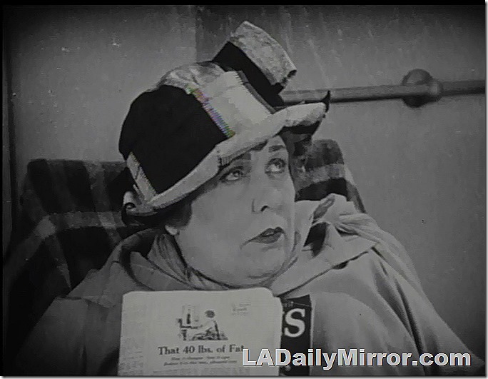 A woman in a hat that comes down to her eyes. 