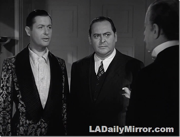 Mystery Man No. 1 in a dressing gown. No. 2 in a suit. 