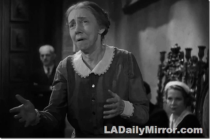 Woman in dress with lace collar and cuffs. She's upset. 