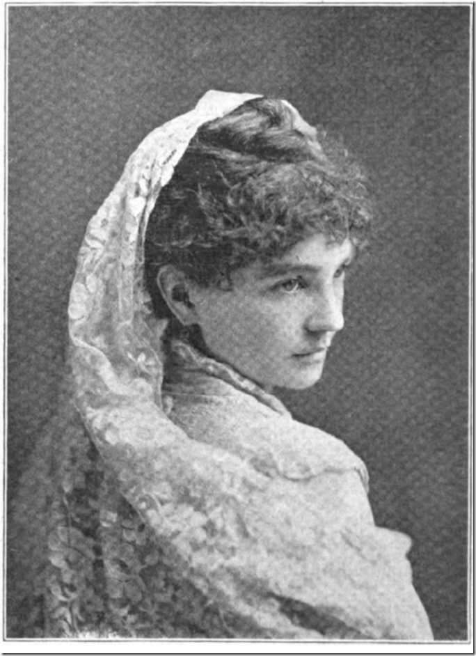 May Whitney Emerson. She looks in 3/4 profile toward the camera, a scarf partially covering her head. 