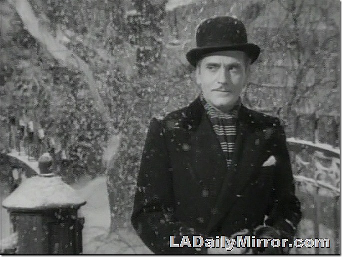 Outside. It's snowing. Man in a derby, overcoat and scarf. Outside. It's snowing. Man in a derby, overcoat and scarf.