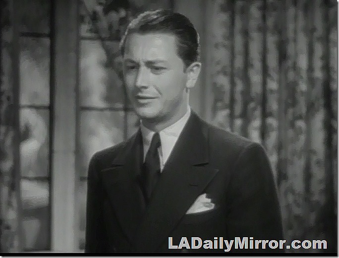 Young man in double-breasted suit, tie and pocket handkerchief. Young man in double-breasted suit, tie and pocket handkerchief.