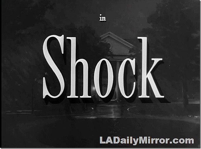 Main Title. White letters over a building at night -- in the rain. 