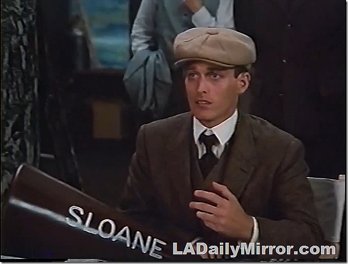 Man in newsboy cap. Wears three-piece suit. 