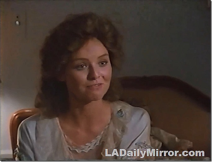 Woman with big hair in a vintage nightgown