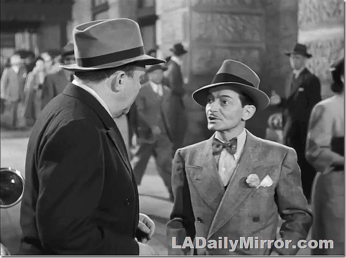 Man with wide lapels and bow tie. 