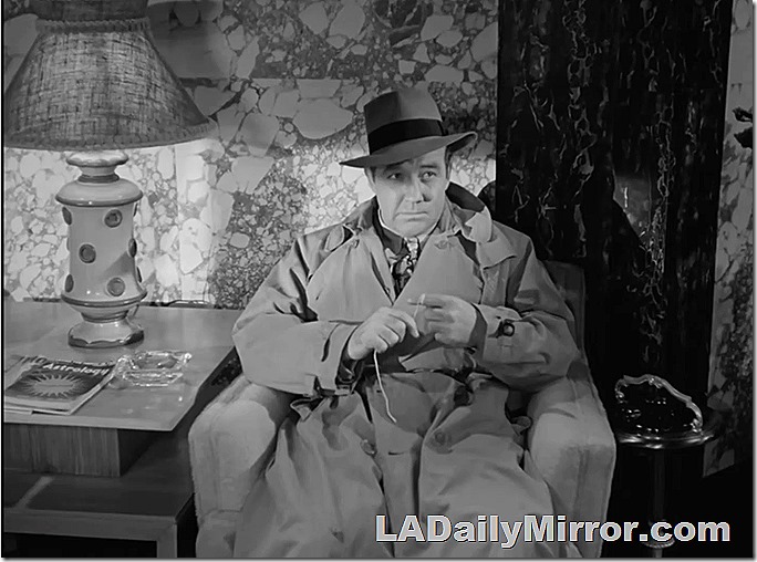 Man trenchcoat and hat. Alerting Lamps of Noir