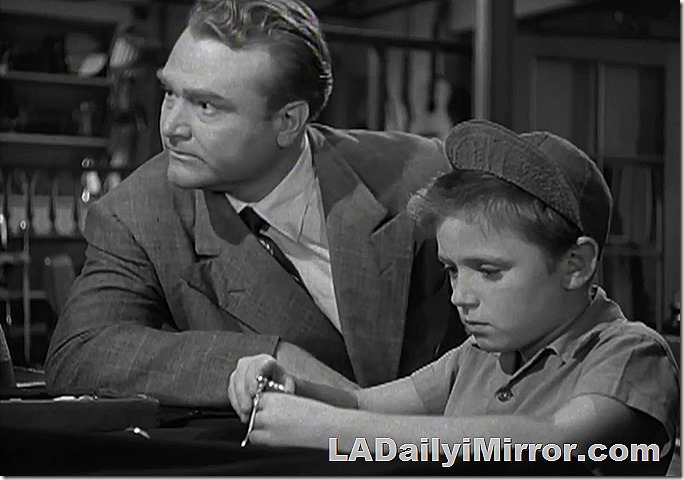 Man in a suit and tie, boy in a cap. Man in a suit and tie, boy in a cap.