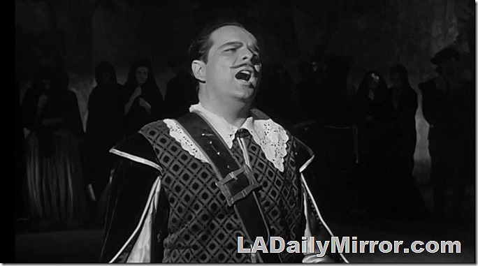 Man in costume singing,