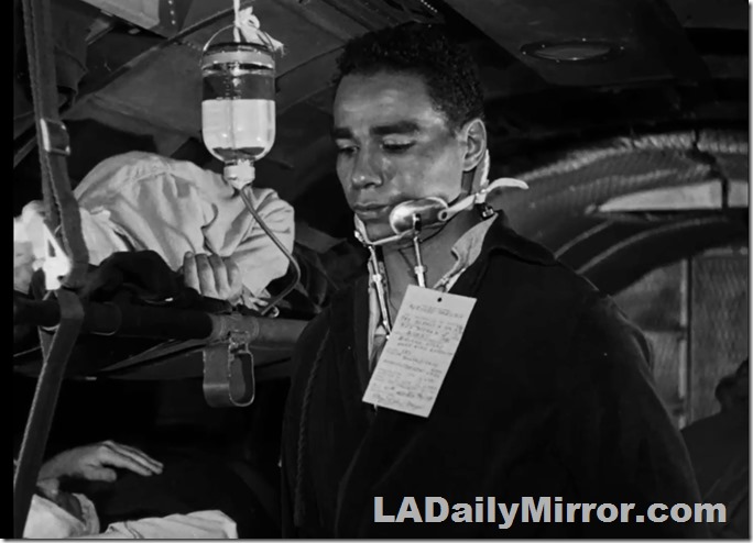 Man in neck brace. An IV bottle is nearby.