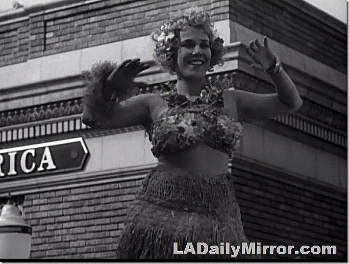Mystery woman dressed as hula dancer. 