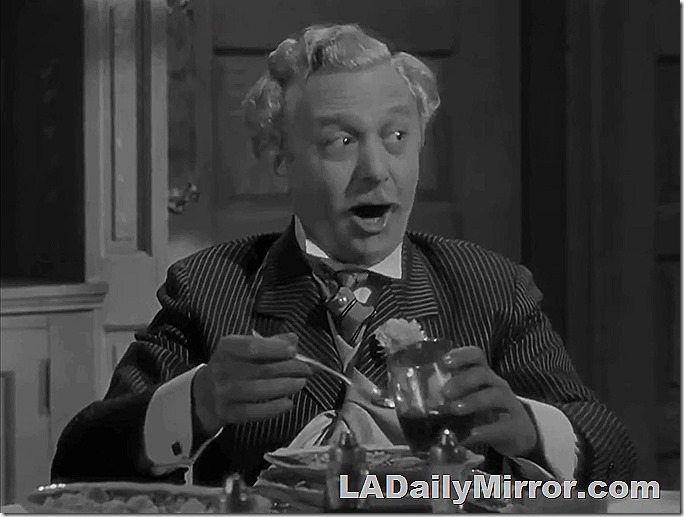 Man with a loud suit coat, cravat and cufflinks eating soup. Man with a loud suit coat, cravat and cufflinks eating soup.