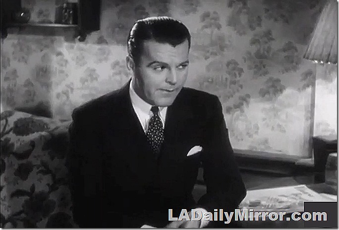 Man in suit a tie, with suspicious expression. 