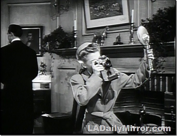 Mystery woman with camera and flash