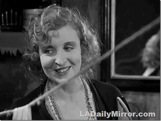 Woman wearing a couple of long necklaces. Woman wearing a couple of long necklaces.