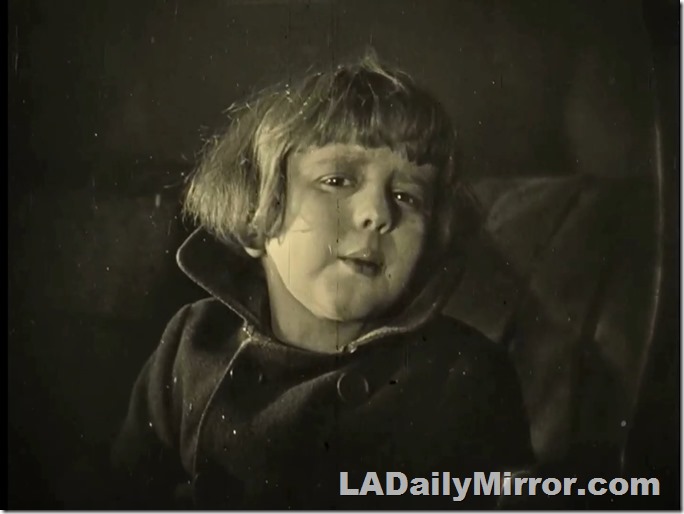 Mysterious lad with Buster Brown haircut. 