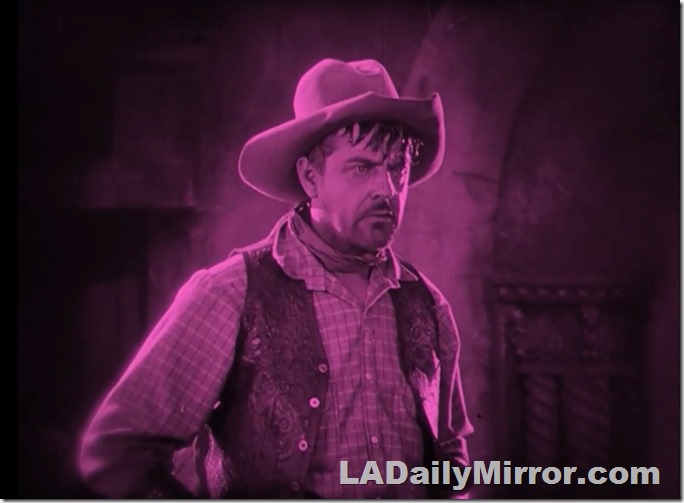 Cowboy in hat, shirt and vest. With neckerchief. 