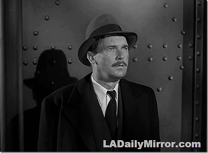 Man in hat, coat and tie with slight mustache. Man in hat, coat and tie with slight mustache.